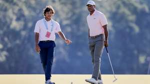 epa11404016 Tiger Woods (R) of the US and his son Charlie (L) on the third hole during a practice round for the 2024 US Open golf tournament at Pinehurst No. 2 course in Pinehurst, North Carolina, USA, 11 June 2024.  EPA/ERIK S. LESSER