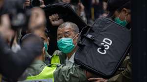 epa12205626 (FILE) - Media mogul and Apple Daily founder Jimmy Lai (C) is escorted out of a Correctional Services Department vehicle and into the Court of Final Appeal in Hong Kong, China, 09 February 2021 (reissued 30 June 2025). The fifth anniversary of Hong Kong's National Security Law is marked on 30 June 2025.  EPA/JEROME FAVRE *** Local Caption *** 56682379