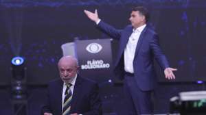 epa13314646 The President of Brazil and candidate for reelection, Luiz Inacio Lula da Silva (L), and opposition candidate Flavio Bolsonaro speak during the first presidential debate at the Rede Bandeirantes headquarters in Sao Paulo, Brazil, 18 October 2026. Lula attacked Bolsonaro by linking him to Argentine President Javier Milei and US President Donald Trump; meanwhile, the opposition candidate responded by connecting his opponent to Nicaraguan Head of State Daniel Ortega and deposed Venezuelan president Nicolas Maduro.  EPA/SEBASTIAO MOREIRA