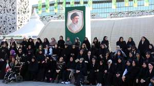epa13280997 Volunteered Iranian women sit under a picture of Iranian supreme leader Ayatollah Mojtaba Khamenei at the Jan-Fada ('Self-Sacrificed for Iran') military training camp, at Imam Hussein square in Tehran, Iran, 04 October 2026. The camp was opened in Tehran as part of the mobilization movement amid tensions between the US and Iran.  EPA/ABEDIN TAHERKENAREH RESTRICTIONS: NO Access Israel Media/Persian Language TV Stations Outside Iran/Strictly No Access BBC Persian/VOA Persian/Manoto TV/Iran International TV. (As mandated by Iran's Directorate General for Foreign Media) --