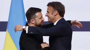 epa11396344 French President Emmanuel Macron (R) greets Ukrainian President Volodymyr Zelensky (L) during a joint press conference at the Elysee Palace in Paris, France, 07 June 2024. Zelensky arrived in France on 06 June to attend commemorations of the 80th anniversary of D-Day in Normandy.  EPA/YOAN VALAT / POOL