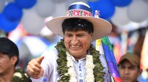 epa11784585 Former Bolivian President Evo Morales (2006-2019) greets supporters during an event at the Chimore stadium, Bolivia, 18 December 2024. A crowd of Morales' supporters proclaimed him as the 'sole candidate' for the 2025 elections, even if he is imprisoned over the aggravated human trafficking case for which there is an arrest warrant against him.  EPA/Jorge Abrego