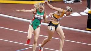epa12375998 Nele Wesel (R) of Germany and Salome Afonso of Portugal try to stay upright after getting in each others way while competing in the Women's 1500m semi finals at the World Athletics Championships 2025 in Tokyo, Japan, 14 September 2025.  EPA/KIYOSHI OTA