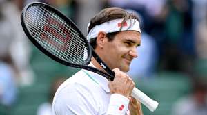 epa09328984 Roger Federer of Switzerland reacts during the men's quarter final match against Hubert Hurkacz of Poland at the Wimbledon Championships, in Wimbledon, Britain, 07 July 2021.  EPA/NEIL HALL   EDITORIAL USE ONLY