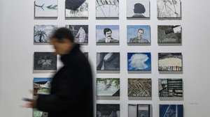 epa10484134 A man walks by several artworks belonging to Henrique Faria collection at ARCO Madrid International Contemporary Art Fair at IFEMA Madrid fair ground, in Madrid, Spain, 22 February 2023. ARCOmadrid fair celebrates its 42nd edition from 22 to 26 February 2023 with the participation of 218 galleries and The Mediterranean Sea as the central theme.  EPA/Rodrigo Jimenez
