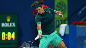 epa09065793 A handout photo made available by beIN Sports of Roger Federer of Switzeland playing a forehand against Daniel Evans of Great Britain during their match at the Qatar Exxonmobil Open in Doha, Qatar, 10 March 2021.  EPA/Samer F Rejjal / HANDOUT by beIN Sports  SHUTTERSTOCK OUT HANDOUT EDITORIAL USE ONLY/NO SALES