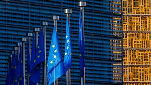 epa11479365 European flags fly in front of the European Commission (L) and the Council (R) at the beginning of the EU Agriculture and Fisheries Council in Brussels, Belgium, 15 July 2024. According to EU Commission, the upcoming meeting of EU Agriculture Ministers will address trade-related agricultural issues and strategies to enhance the long-term sustainability of rural communities. The agenda will also include a focus on generational renewal and demographic trends.  EPA/OLIVIER MATTHYS