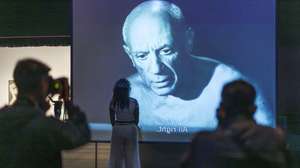 epa12379741 Visitors watch a projection about Spanish artist Pablo Picasso during the press preview of the new exhibition 'Theatre Picasso' at Tate Modern in London, Britain, 15 September 2025. The exhibition explores Picasso's fascination with performers, dancers, entertainers, and bullfighters that he painted, and it runs from 17 September 2025 to 12 April 2026.  EPA/TOLGA AKMEN