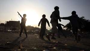 epa12609113 Yemeni children play a war game with toy weapons in a neighborhood of Sana'a, Yemen, 22 December 2025. UNICEF has warned of the impacts of a decade of Yemen's conflict on children, with over 10 million children living in deprivation, including 4.5 million out of school.  EPA/YAHYA ARHAB