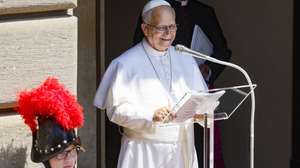 epa13106715 Pope Leo XIV delivers the Angelus prayer from the entrance of the Apostolic Palace overlooking Piazza della Liberta at the papal summer residence in Castel Gandolfo, near Rome, Italy, 12 July 2026.  EPA/FABIO FRUSTACI