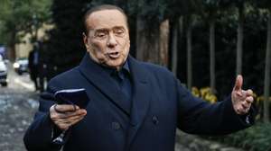 epa09655095 Forza Italia leader Silvio Berlusconi speaks to journalists at the end of the center-right summit at Villa Grande, Rome, Italy, 23 December 2021.  EPA/FABIO FRUSTACI
