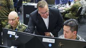 epaselect epa12062519 German Defense Minister Boris Pistorius (C) visits the 'Locked Shields' exercise in Kalkar, Germany, 29 April 2025. The annual exercise, organised by the NATO Cooperative Cyber Defense Centre of Excellence (CCDCOE) since 2010, enables cyber security experts to enhance their skills in defending national IT systems and critical infrastructure under real-time attacks, according to the CCDCOE.  EPA/CHRISTOPHER NEUNDORF