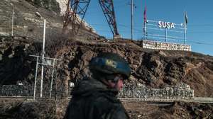 epa09033345 (15/27) A Russian peacekeeping soldier stands at a checkpoint in Shusha, Azerbaijan, 14 January 2021. Russian soldiers control checkpoints and crossing is only allowed without guns. The conquest of Shusha by Azerbaijan on 08 November 2020 meant the final defeat for the Nagorno-Karabakh Army in the 44 days war against Azerbaijan.  EPA/CHRISTOPHE PETIT TESSON  ATTENTION: For the full PHOTO ESSAY text please see Advisory Notice epa09033329 and epa09033330