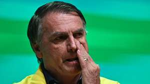 epa11914260 Brazil's former President Jair Bolsonaro (2019-2022) reacts during a 'Partido Liberal' (Liberal Party) event at the Ulysses Guimaraes Convention Center in Brasilia, Brazil, 21 February 2025.  EPA/ANDRE BORGES