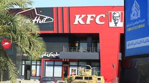epa11389740 An Iraqi military armored truck is stationed in front of a KFC resturant at the Al-Jadriyah district in Baghdad, Iraq, 04 June 2024. Iraqi forces imposed tight security measures around restaurants, after dozens of militants attacked two restaurants in Baghdad late on 03 June 2024 including a KFC resturant, security officials said, amid increasing calls to boycott US brands over war in Gaza.  EPA/AHMED JALIL