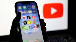 epa12674718 Social media applications displayed on a mobile phone alongside the YouTube logo displayed on a laptop screen in Liverpool, Britain, 23 January 2026. A proposal to ban under-16s from accessing social media in the UK will be considered in the House of Commons after peers in the House of Lords voted 261 to 150 in favour of an amendment to the Children’s Wellbeing and Schools Bill. If adopted, the amendment would require social media companies to implement strict and effective age checks in order to prevent underage users from signing up.  EPA/ADAM VAUGHAN