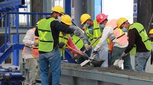 epa09605423 Workers at the China Communications Construction Company (CCCC)-run construction yard in the town of El Triunfo, municipality of Balancan, in Tabasco, Mexico 25 November 2021 (issued 26 November 2021). The Maya Train project, one of the flagship works of the Government of Mexican President Andres Manuel Lopez Obrador, has been delayed by at least five months due to bureaucracy and geological faults, as revealed on 26 November by the general director of the National Fund for the Promotion of Tourism (Fonatur), Rogelio Jimenez. CCCC and Mota-Engil won the Mayan Train contract.  EPA/Manuel Lopez