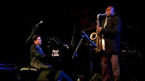 epa09365623 US saxophonist David Murray (R) and Cuban pianist Pepe Rivero (L) perfom on stage during the Jazz on the Coast festival in Almunecar, Granada, Andalusia, Spain, 25 July 2021.  EPA/ALBA FEIXAS