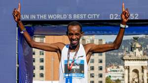 epa10531564 First placed athlete Marius Kimutai, from Barhein, celebrates his victory in the Barcelona Marathon in Barcelona, Spain, 19 March 2023.  EPA/Quique Garcia