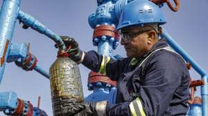epaselect epa10856529 A worker takes crude oil for testing at the Neft Daslari (Oil Rocks) oil rig and industrial settlement incorporating numerous drilling oil platforms at the Caspian Sea, about 100km from Baku, Azerbaijan, 06 September 2023. The name Azerbaijan comes from the Persian 'The Land of Fire', as it has rich oil and natural gas deposits. Most of the production is carried out by The State Oil Company of the Republic of Azerbaijan SOCAR at the Neft Daslari (Oil Rocks) Oil and Natural gas field. Neft Daslari, 55 km from the nearest shore, was the first operating offshore oil platform in the world, including numerous drilling platforms. It is featured in the Guinness Book of World Records as the world's first offshore oil platform. The construction of the settlement began during the Soviet era in 1949. Now the settlement has a system of paths and platforms over 300 km of streets and bridges connecting the artificial islands built on the back of ships sunk, garbage, and underwater rocks to serve as foundation. The population of the settlement is about 2,000 workers.  EPA/MAXIM SHIPENKOV  ATTENTION: This Image is part of a PHOTO SET