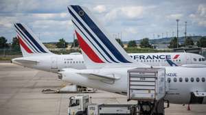 epa10046240 Air France aircrafts are parked at Roissy Airport outside Paris, France, 01 July 2022. Unions representing Air France and airport workers have called for a strike.  EPA/CHRISTOPHE PETIT TESSON