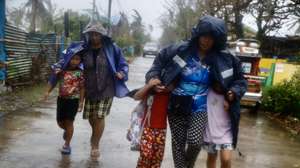 epa11719792 Filipino villagers evacuate in the coastal municipality of Santa Ana, Cagayan province, Philippines, 14 November 2024. After the onslaught of Typhoons Toraji, Trami, Yinxing and Kong-rey, the Philippines now brace for the landfall of Typhoon Usagi, the fifth major storm to hit the country in three weeks. Government officials warned residents of possible landslides due to ground saturation from successive typhoons impacting the Luzon island.  EPA/FRANCIS R. MALASIG