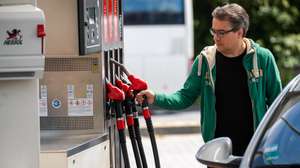 epa09989720 A man takes a petrol pump at a gas station in Frankfurt am Main, Germany, 01 June 2022. From 01 June on, a discount on fuel tax comes into effect.  EPA/CONSTANTIN ZINN