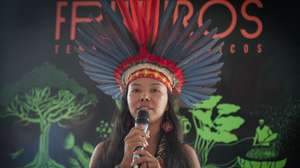 epa09646880 Indigenous Vanda Ortega, from the Witoto people, speaks during the opening of the exhibition 'Fruturos - Tempos Amazonicos' (Fruits - Amazon Times) at the Amanha Museum in Rio de Janeiro, Brazil, 16 December 2021 (issued 17 December 2021). The immensity of the Amazon, its richness, the ethnic groups that live there and their customs, are part of an exhibition in Rio de Janeiro that from 17 December on immerses the viewer in the reality of the most extensive tropical forest on the planet to highlight the urgency of its conservation. The exhibition 'Futures', which can be seen until June 2022 at the Museum of Tomorrow in Rio, brings an updated perspective of this biome and proposes new challenges to keep the forest standing.  EPA/Andre Coelho