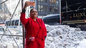 epa12700776 A nurse takes a photograph while marching to New York Governor Kathy Hochul's office as the strike continues in New York, New York, 02 February 2026. Nearly 15,000 nurses at major hospital systems—specifically Mount Sinai Hospital, Montefiore Medical Center, and NewYork-Presbyterian— have been on strike since 12 January, marking it as the largest nurses' strike in the city's history.  EPA/OLGA FEDOROVA