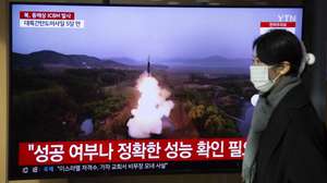 epa11035330 A woman watches the news at a station in Seoul, South Korea, 18 December 2023. According to South Korea's Joint Chiefs of Staff (JCS), North Korea launched an Intercontinental Ballistic Missile (ICBM) into the East Sea on 18 December.  EPA/JEON HEON-KYUN