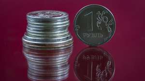 epa09900395 A photo illustration shows Russian ruble coins in Moscow, Russia, 21 April 2022. The Russian ruble continues to strengthen against other currencies and has reached 77,08 for the US Dollar and  83,27 for the Euro.  EPA/YURI KOCHETKOV
