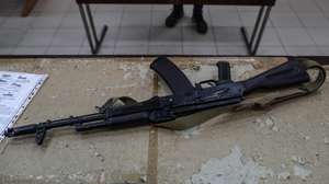 epa09840905 AK-47 rifle is seen on the table while locals of Odessa learn war tactics and how to handle weapons, in south Ukrainian city of Odesa, in Ukraine, 21 March 2022. Russian troops entered Ukraine on 24 February prompting the country's president to declare martial law and triggering a series of announcements by Western countries to impose severe economic sanctions on Russia.  EPA/SEDAT SUNA
