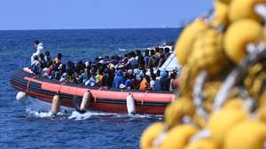 epa10861731 Some migrants are taken in dinghy to board the 'Galaxy' ferry which will head towards Porto Empedocle, Lampedusa, southern Italy, 15 September 2023. A record number of migrants and refugees have arrived on the Italian island of Lampedusa in recent days. Lampedusa's city council declared a state of emergency on 13 September evening after a 48-hour continuous influx of migrants. In the morning of September 14, nearly 7,000 migrants were on the island.  EPA/CIRO FUSCO