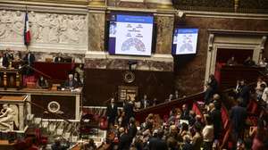 epa13113416 Screens display the results of the vote, 291 in favor and 241 against, on a bill on the right to assisted dying at the National Assembly in Paris, France, 15 July 2026.  EPA/TERESA SUAREZ