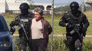 epa12998897 Gerson Palermo (C), identified by authorities as a leader of Brazil's First Capital Command (PCC) criminal organization, is escorted by members of Bolivia's Special Force for the Fight Against Drug Trafficking (FELCN) in Santa Cruz, Bolivia, 27 May 2026. Palermo, who was captured on 26 May, was handed over to Brazilian authorities.  EPA/Juan Carlos Torrejon