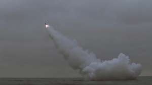 epa10519110 A photo released by the official North Korean Central News Agency (KCNA) shows a cruise missile being launched from a North Korean submarine off the east coast of North Korea, 12 March 2023 (issued 13 March 2023). According to North Korean state media, two cruise missiles were launched from a 8.24 Yongung submarine, and travelled aroud 1,500 km before striking a sea-borne target. The missile launch occured a day before the scheduled start of US-South Korean joint military drills.  EPA/KCNA   EDITORIAL USE ONLY