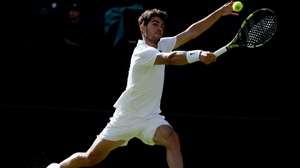epa12225082 Carlos Alcaraz of Spain in action during the Men's quarterfinal match against Cameron Norrie of Britain at the Wimbledon Championships, Wimbledon, Britain, 08 July 2025.  EPA/NEIL HALL  EDITORIAL USE ONLY