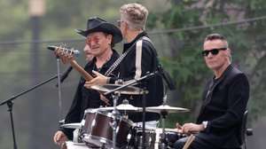 epa12952105 (L-R) U2 members Bono, Adam Clayton, and Larry Mullen Jr. film the music video for the song 'Street of Dreams' in Mexico City’s Historic Center in Mexico City, Mexico, 12 May 2026.  EPA/Madla Hartz