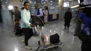 epa10628629 A Yemeni evacuated from Sudan arrives at Sana'a airport, in Sana'a, Yemen, 14 May 2023. Over 370 Yemenis were evacuated from Sudan on 14 May to the Yemeni cities of Sana’a and Aden, bringing the total of Yemenis evacuated from Sudan since the beginning of the conflict to more than 1,200. Heavy armed clashes between Sudan's military and rival paramilitary groups have occurred in the capital Khartoum and other parts of the country since 15 April 2023.  EPA/YAHYA ARHAB