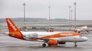 epa08788741 Aircraft of airline Easyjet arrives at Berlin&#039;s airport &quot;Berlin Brandenburg Airport Willy Brandt&quot;, during the opening on the first day of operation for the new BER Berlin Brandenburg Airport on October 31, 2020 in Schoenefeld, Germany. The new airport incorporates former Schoenefeld airport as its Terminal 5 and also replaces Tegel Airport, which will close in coming days. Berlin Brandenburg Airport was originally scheduled to open in 2011 but was stricken by design flaws, corruption scandals, legal wranglings and failed technical audits. The airport will serve Berlin and the surrounding region.  EPA/Maja Hitij / POOL