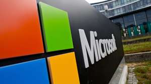 epa04863560 The Microsoft logo outside the software company's German headquarters in Unterschleissheim, Germany, 28 July 2015. Microsoft will launch its new and much anticipated operating system Windows 10 on 29 July 2015.  EPA/SVEN HOPPE