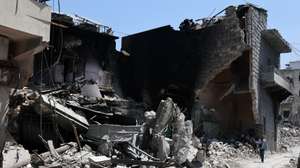 epa13053933 A man walks past a destroyed building targeted by Israeli air strikes on the historic old market in the town of Nabatieh, southern Lebanon, 21 June 2026, following the ceasefire between Israel and Hezbollah.According to the Lebanese Ministry of Health, as of 20 June, Israeli attacks across Lebanon have killed more than 4,057 people and injured more than 12,100 since renewed hostilities between Israel and Hezbollah began on 02 March 2026.  EPA/WAEL HAMZEH