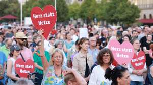 epa11569513 A participant holds a red heart-shaped placard reading &#039;Heart instead of agitation&#039; during a protest in commemoration of the Solingen terror attack at the Brandenburg Gate in Berlin, Germany, 28 August 2024. A man stabbed passers-by at random with a knife during the city festival in Solingen on 23 August 2024 evening. Three people have been killed and eight others injured, five of them seriously, in the knife attack, police said. The protest at the Brandenburg Gate in Berlin was announced by the campaigning organization Campact and organized by the initiative &#039;Heart instead of agitation&#039; in order to commemorate the victims of the attack under the motto &#039;Fight Islamism, defend the right to asylum&#039;.  EPA/CLEMENS BILAN