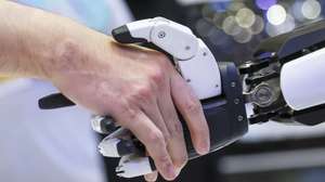 epa12091103 People shake hands with 'Mornine,' a Chery Automobile humanoid robot sales assistant, during the Malaysia Autoshow 2025 in Kuala Lumpur, Malaysia, 10 May 2025 (issued 11 May 2025). The Chery AiMOGA robot, nicknamed 'Mornine,' is a 1.66-meter-tall humanoid sales assistant made by Chery. Originally a virtual character for young people, it is now a physical robot with advanced sensors, flexible limbs, and a silicone face with realistic facial expressions. These robots use open-source AI models to interact with people and will be used in Chery showrooms for customer service in the future.  EPA/FAZRY ISMAIL