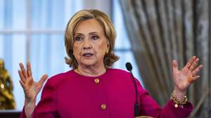 epa10884765 Former Secretary of State Hillary Clinton speaks ahead of the unveiling of her official portrait at the State Department in Washington, DC, 26 September 2023. Former President Bill Clinton also attended the ceremony.  EPA/JIM LO SCALZO