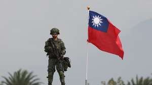 epa12684011 A Taiwanese military personnel stands next to Taiwan flag inside a military base during the Taiwan Military Combat Readiness Drill in Taichung, Taiwan, 27 January 2026. Taiwan’s Ministry of National Defense warns that delays in approving a 1.25 trillion New Taiwan Dollar special defense budget risk missing a 45-day deadline to sign a US arms pricing offer.  EPA/RITCHIE B. TONGO