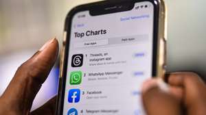 epa10732131 An employee downloads the newly unveiled Threads app on an iPhone at a design company in Chennai, India, 07 July 2023. Meta, the company behind Facebook and Instagram, said in a press release on 05 July 2023, that Mark Zuckerberg announced the initial version of 'Threads', an Instagram's text-based conversation app.  EPA/IDREES MOHAMMED