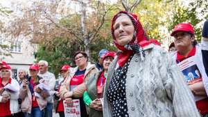 epa12388102 An elderly woman attends to an electoral meeting with citizen in Soldanesti city, Moldova, 18 September 2025. Moldova's parliamentary elections are scheduled for 28 September 2025.  EPA/DUMITRU DORU