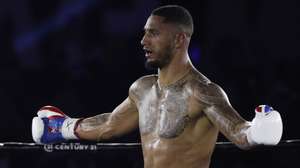 epa09460364 French boxer Tony Yoka celebrates after defeating Petar Milas of Croatia in their International heavyweight 10 rounds bout at Roland Garros in Paris, France, 10 September 2021.  EPA/YOAN VALAT