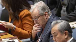epa11905501 China's Foreign Minister Wang Yi (R) and UN Secretary-General Antonio Guterres (C) attend a United Nations Security Council on 'Maintenance of international peace and security: Practicing multilateralism, reforming and improving global governance' at the United Nations (UN) headquarters in New York, New York, USA, 18 February 2025.  EPA/JUSTIN LANE
